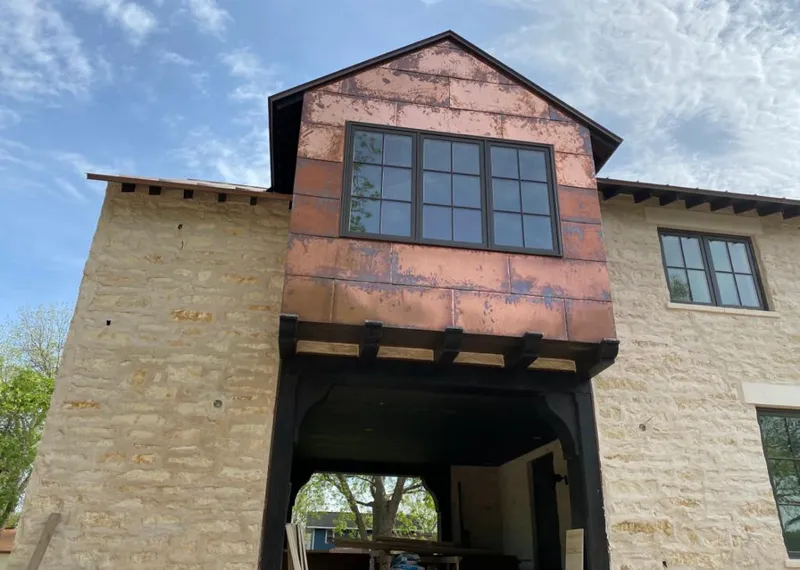 Copper metal panel facade on a stone building for Metal Roof Coating in Brandywine