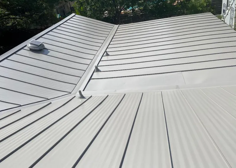 Solar attic fan installed on a metal roof for Roof Ventilation in Brandywine